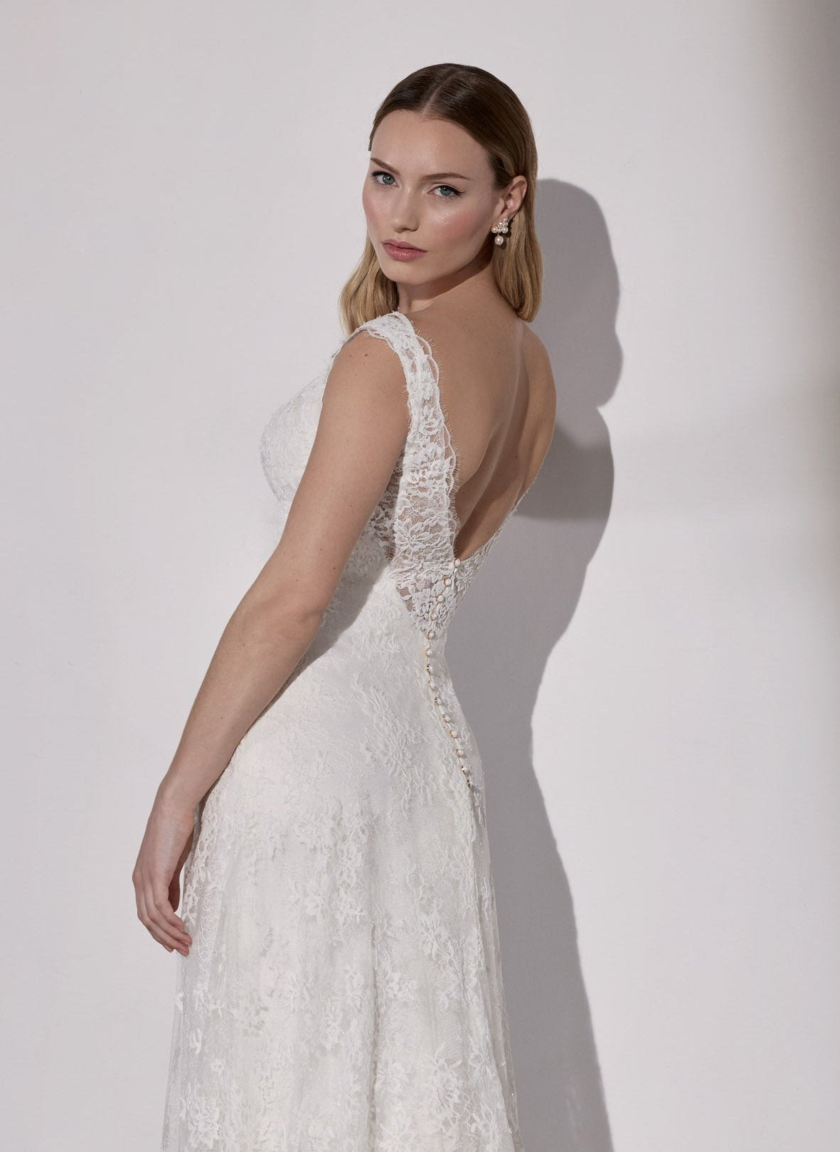 French-look lace slip over satin sheath with flower buttons