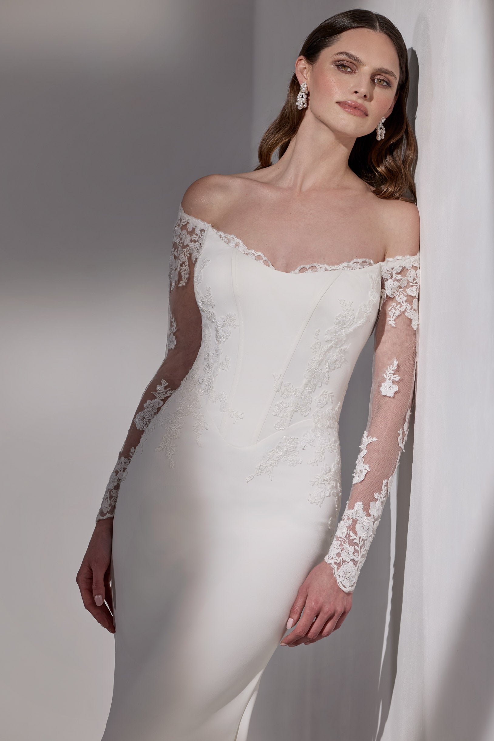 Lux stretch crepe with embroidery lace detail
and illusion train