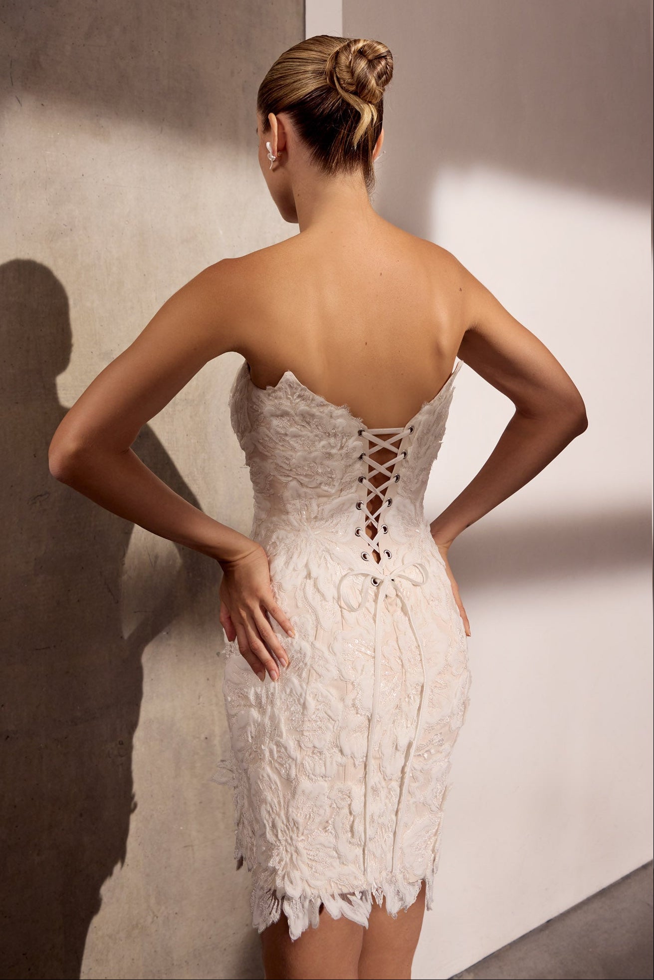 Strapless 3D applique flower mini-dress with
lace-up back detail