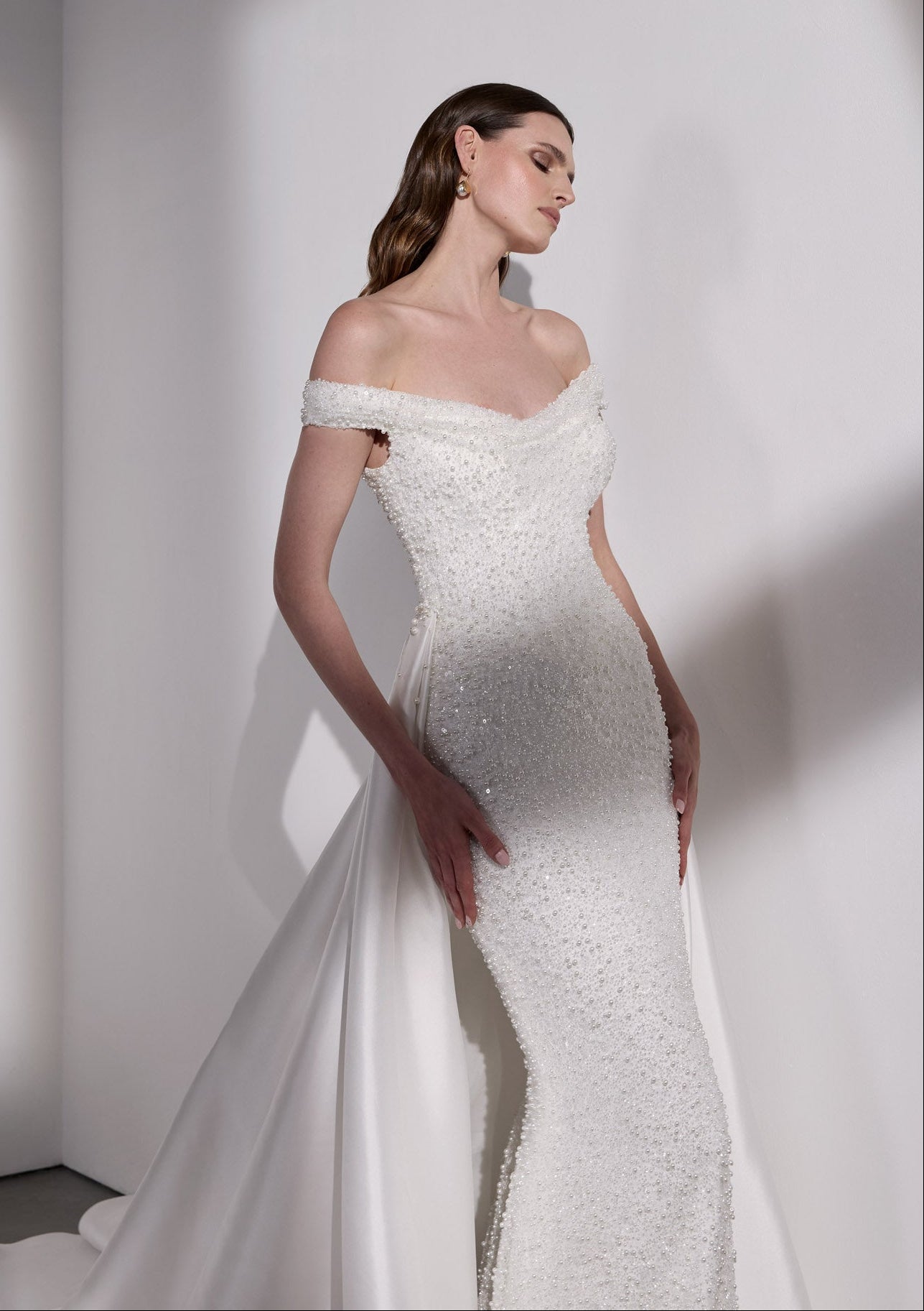 Pearl beaded sheath dress with detachable
mikado overskirt