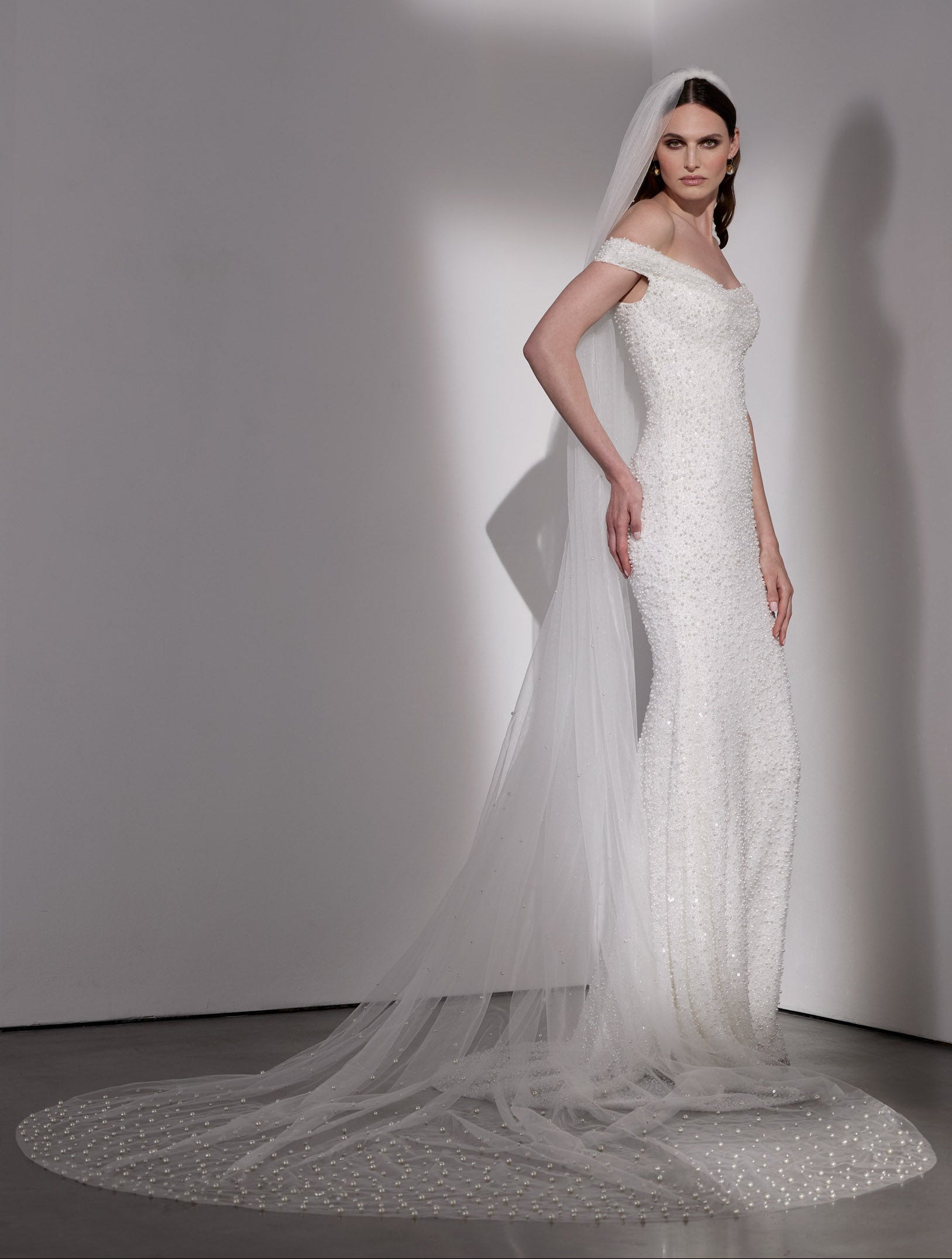 Pearl beaded sheath dress with detachable
mikado overskirt