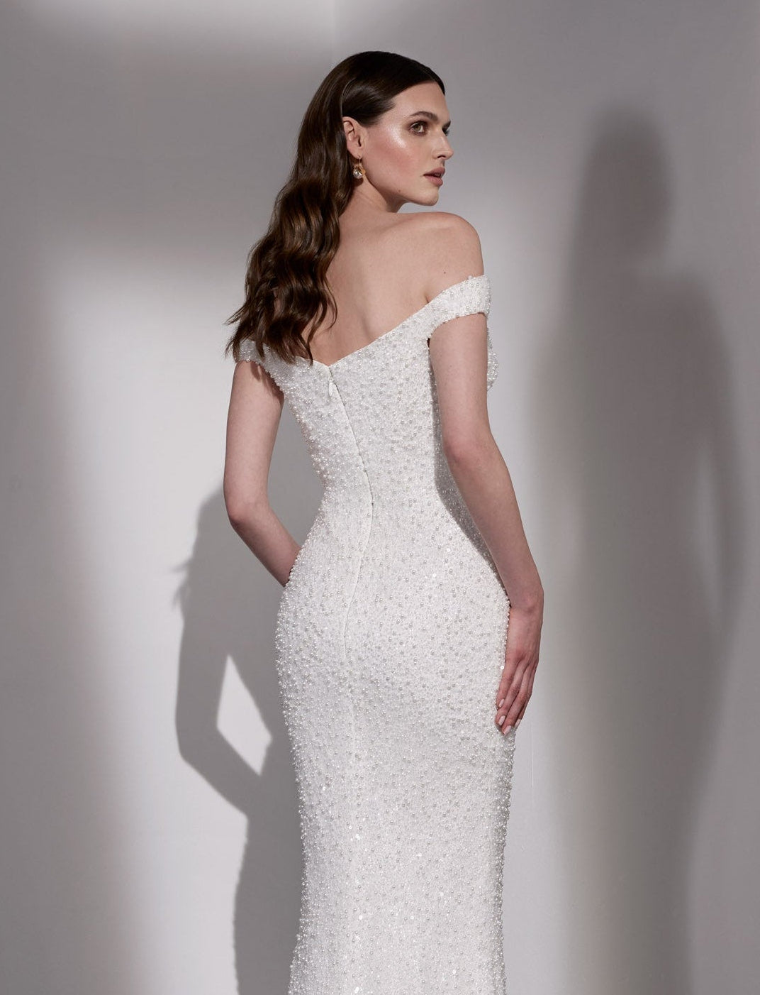Pearl beaded sheath dress with detachable
mikado overskirt