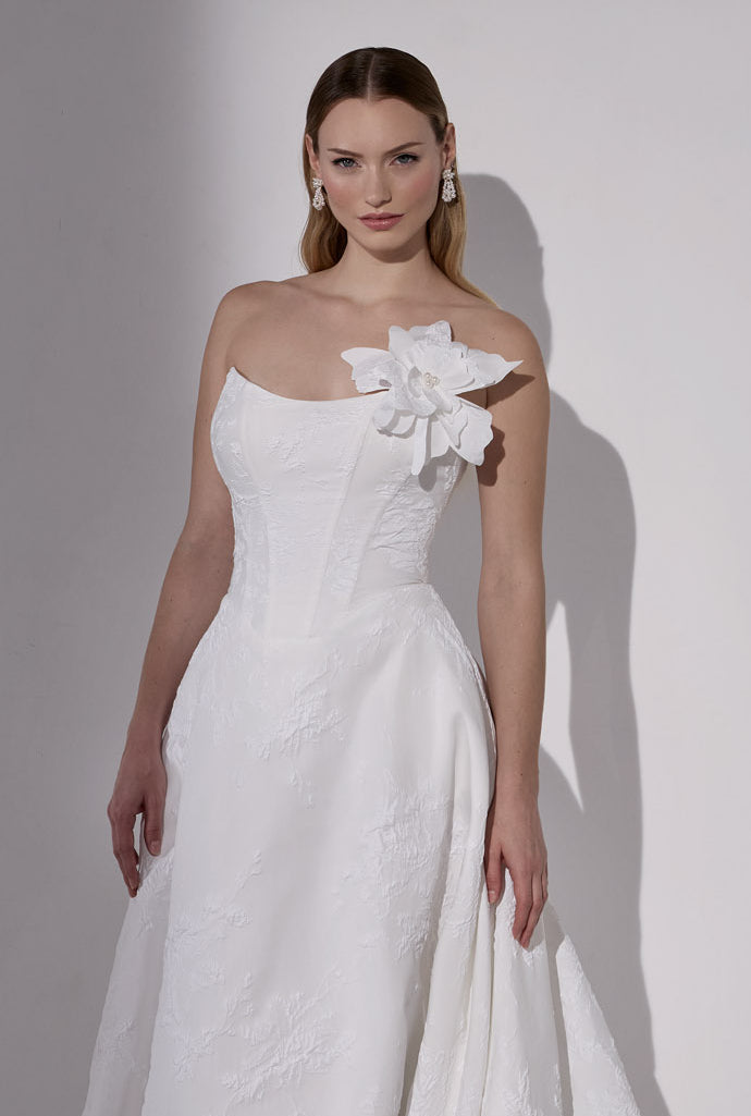 Embossed jacquard basque waist A-Line with
lace-up back and detachable flower