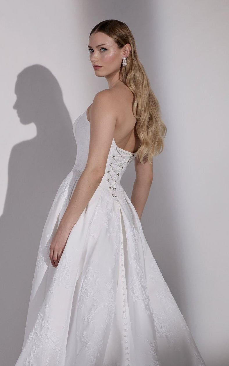 Embossed jacquard basque waist A-Line with
lace-up back and detachable flower