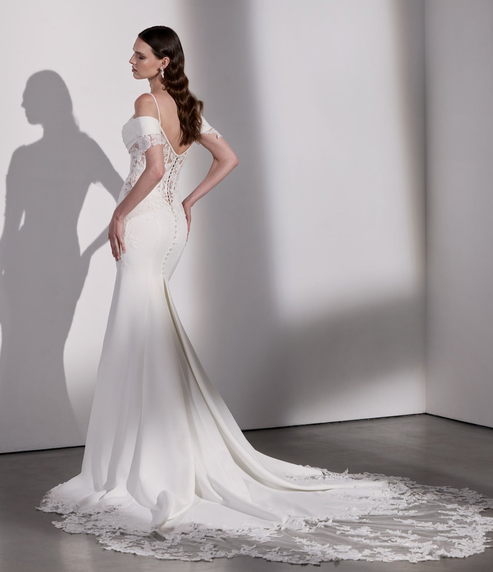 Lux stretch crepe and embroidery lace
basque waist sheath dress with illusion back and pearl buttons and train