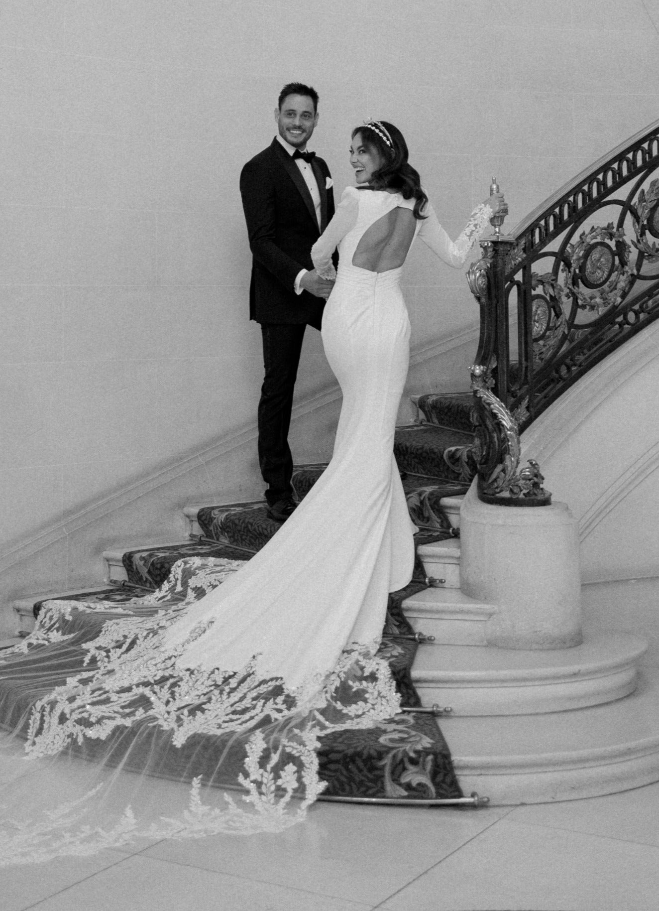 crepe plunge pleat neckline and soft fishtail silhouette with encrusted lace sleeves and train
