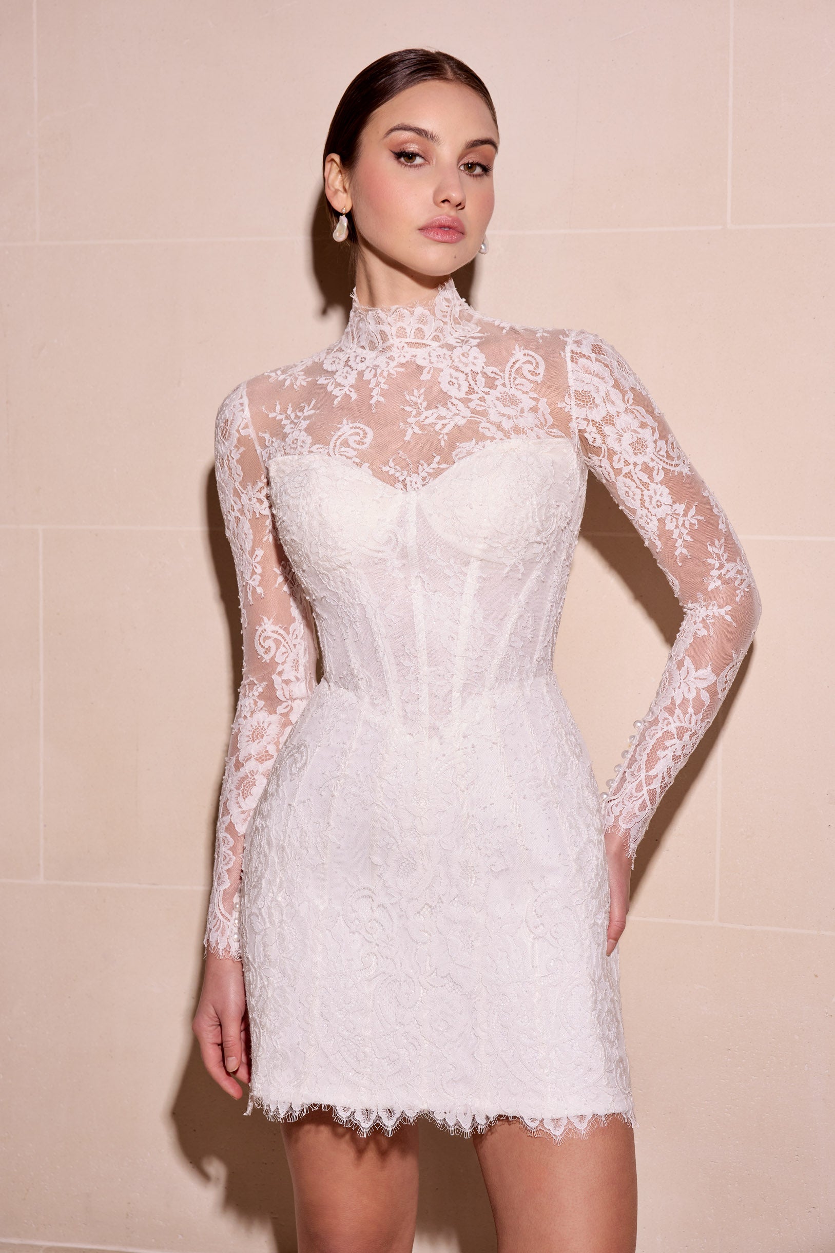 Lace mini dress with sweetheart neckline boning detail and
optional detachable matching lace jacket