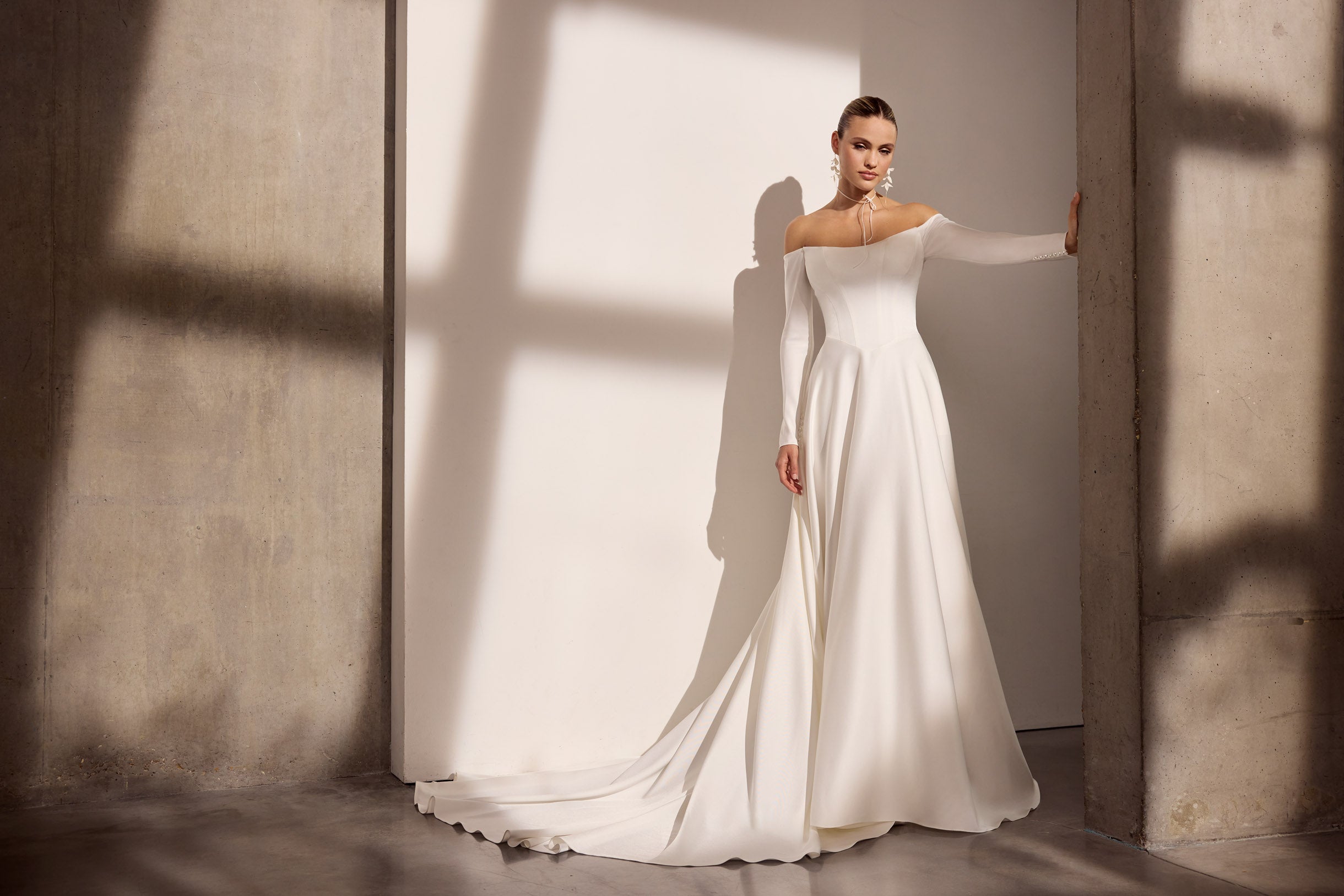 Off-the-shoulder Japanese crepe A-Line basque waist
dress with sleeves and button detail