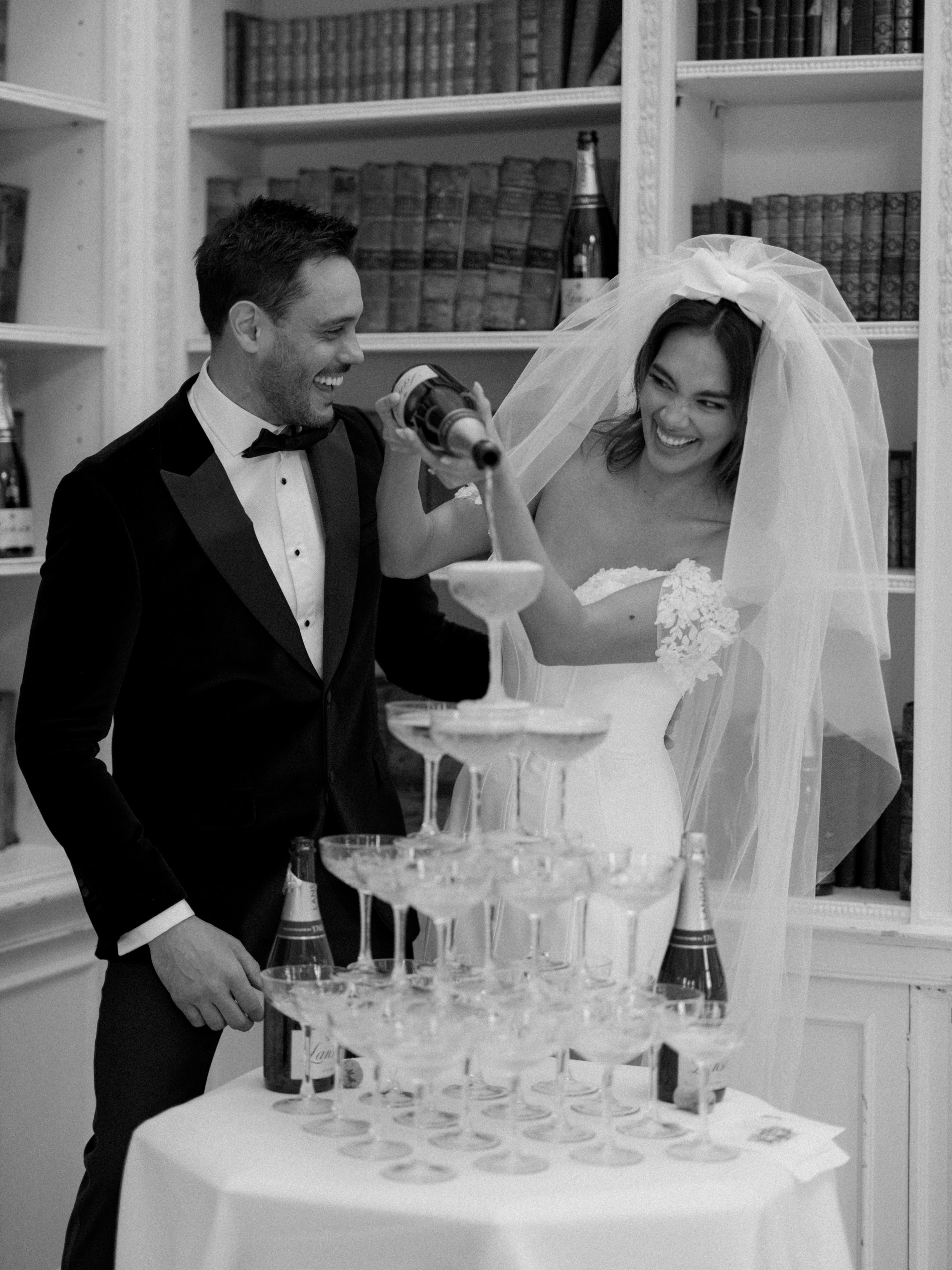 short corseted gown with beaded lace bust and straps and double tier bow veil