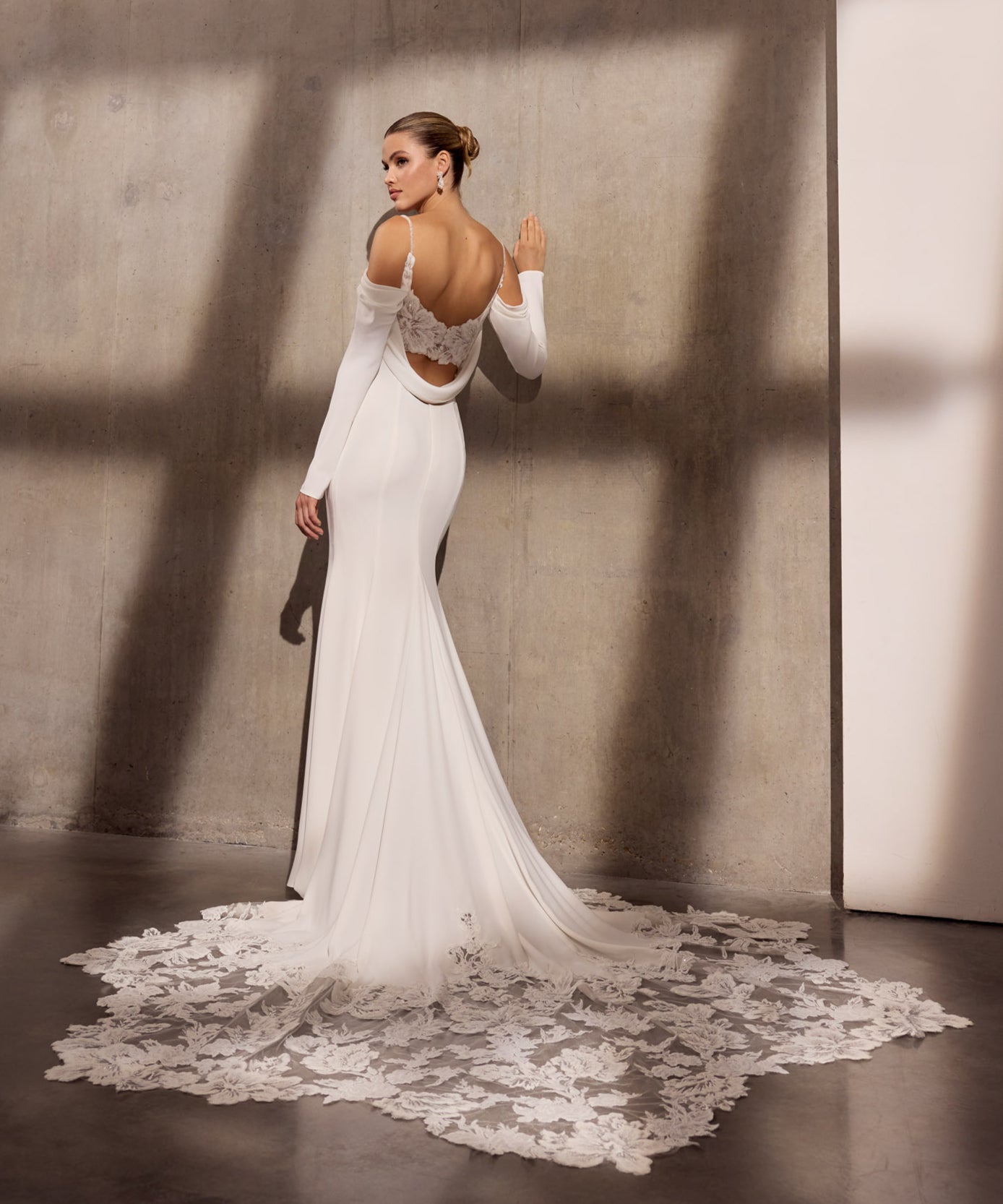 Georgette crepe sheath dress with floral
applique, optional sleeves and illusion train