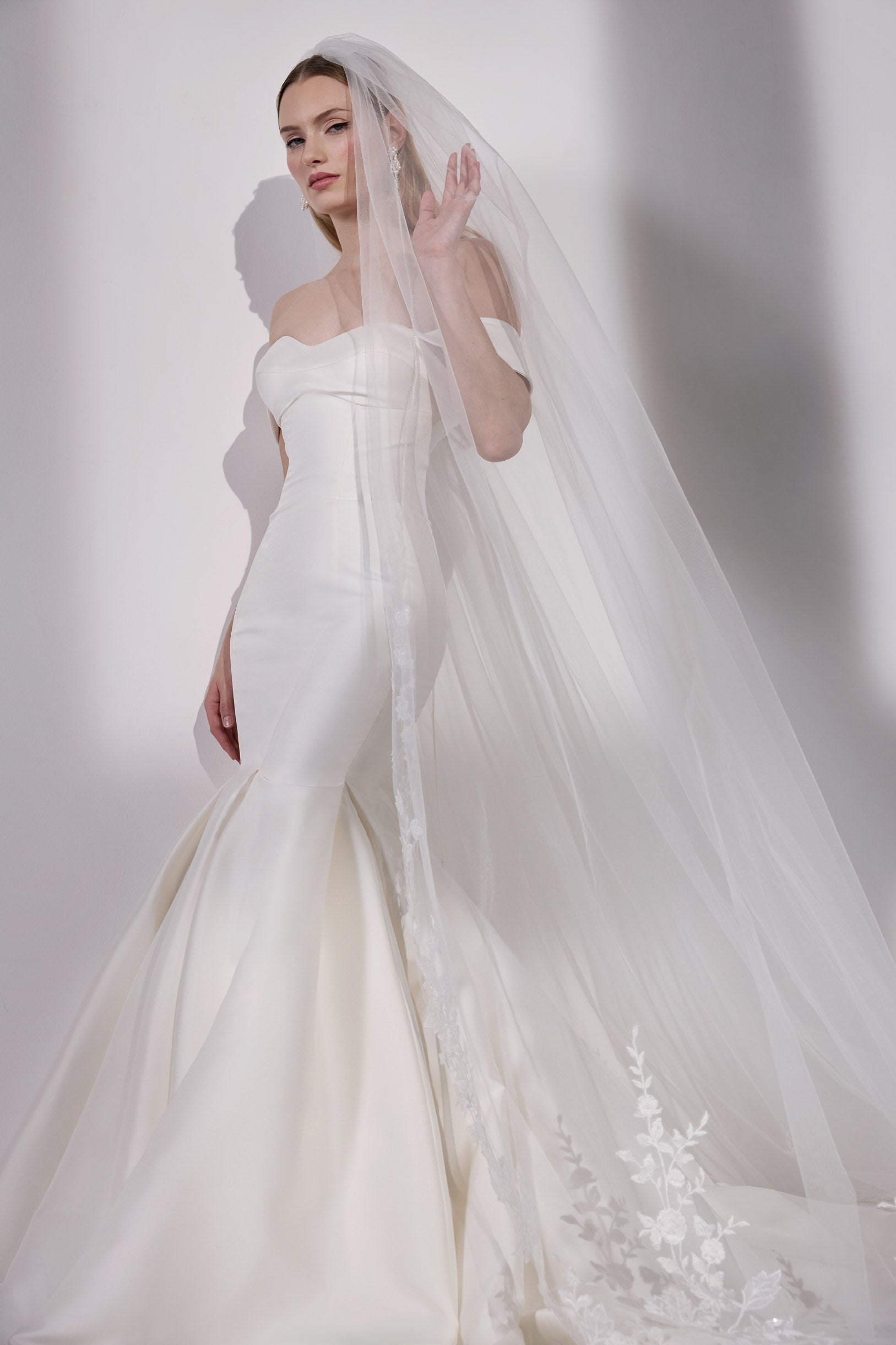 Iredescent Japanese mikado fishtail dress
with detachable straps and lace-up back with single tier lace veil