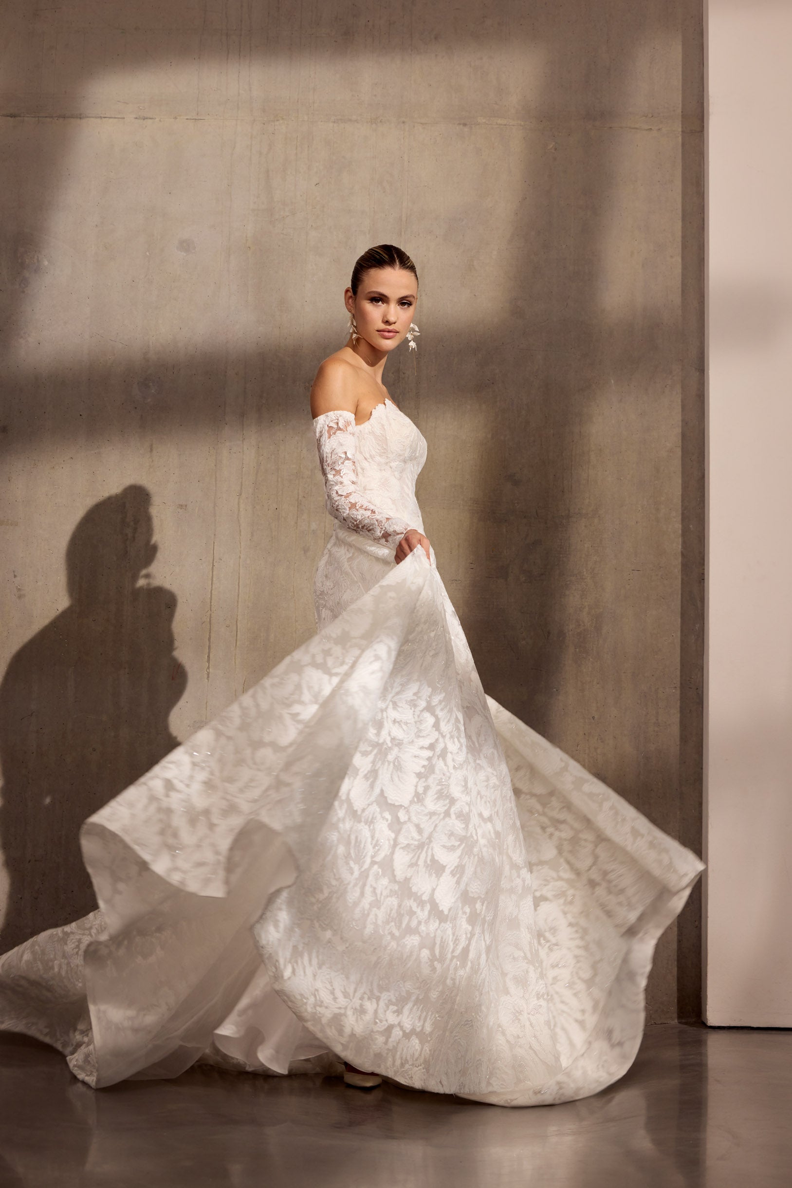 Georgette crepe sheath dress with floral
applique, optional sleeves and illusion train