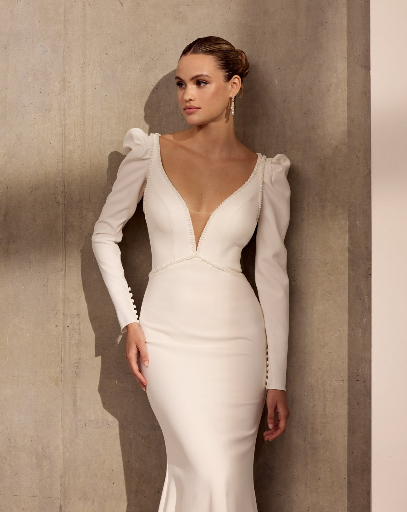 V-neck plunge Lux stretch crepe fluted sheath dress with
pearl detail with matching mutton crepe sleeves