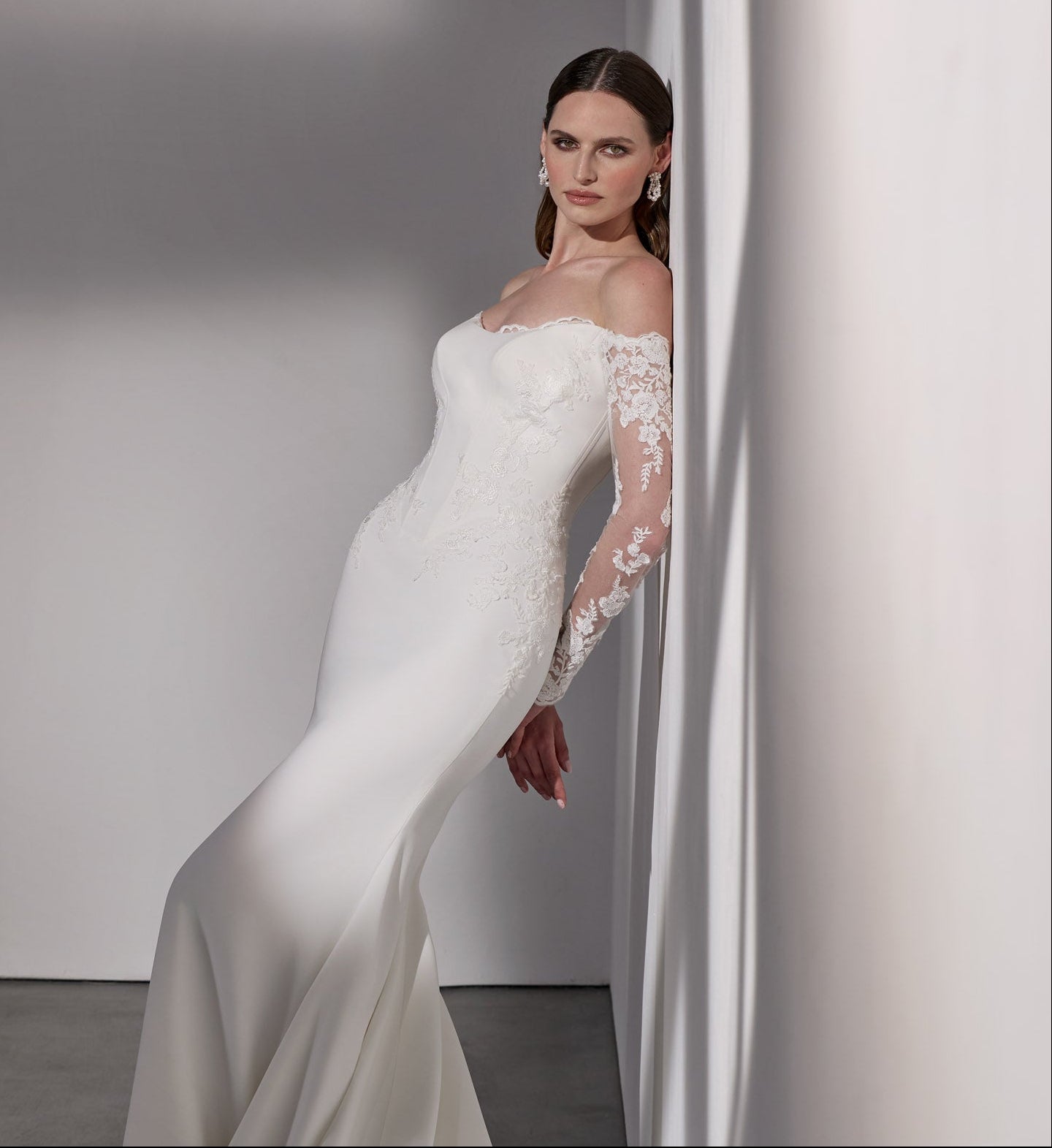 Lux stretch crepe with embroidery lace detail
and illusion train