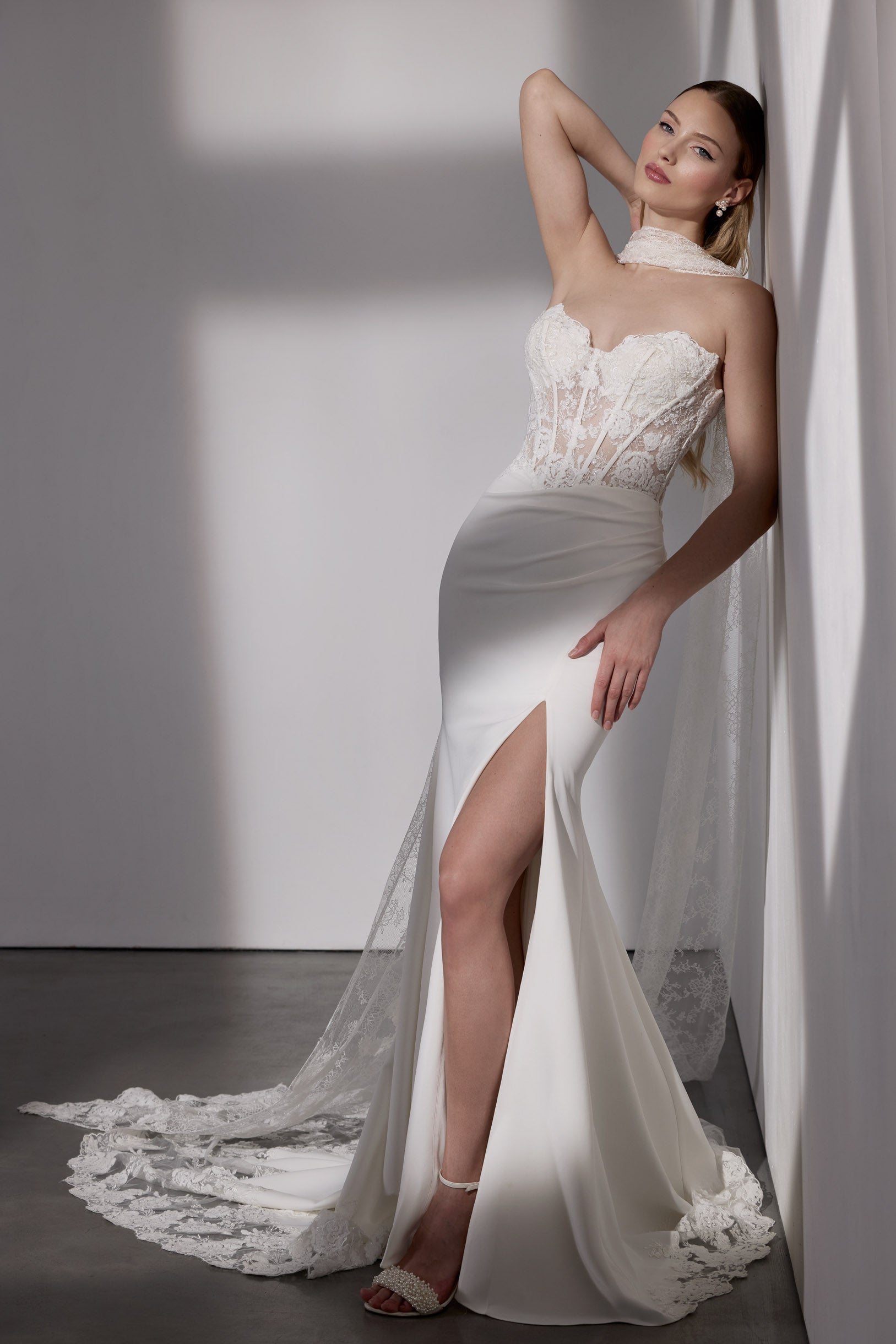 Lux stretch crepe with embellished French-
look lace detail, illusion train and sleeves