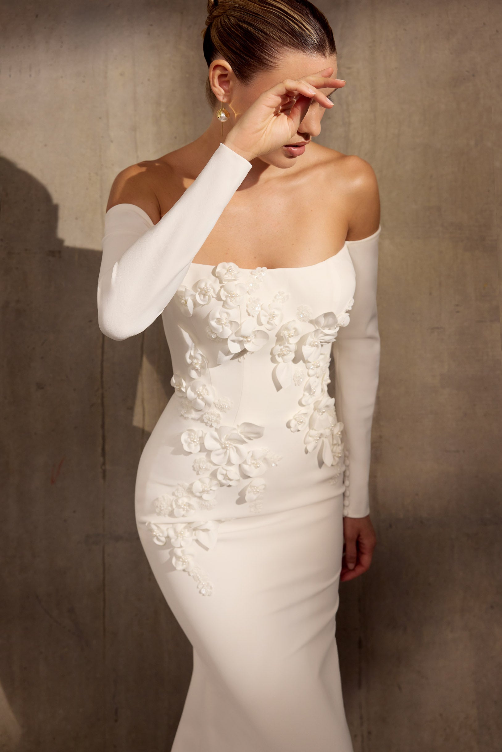 Lux stretch crepe, off-the-shoulder sheath
dress with embellished 3D laser applique
flowers