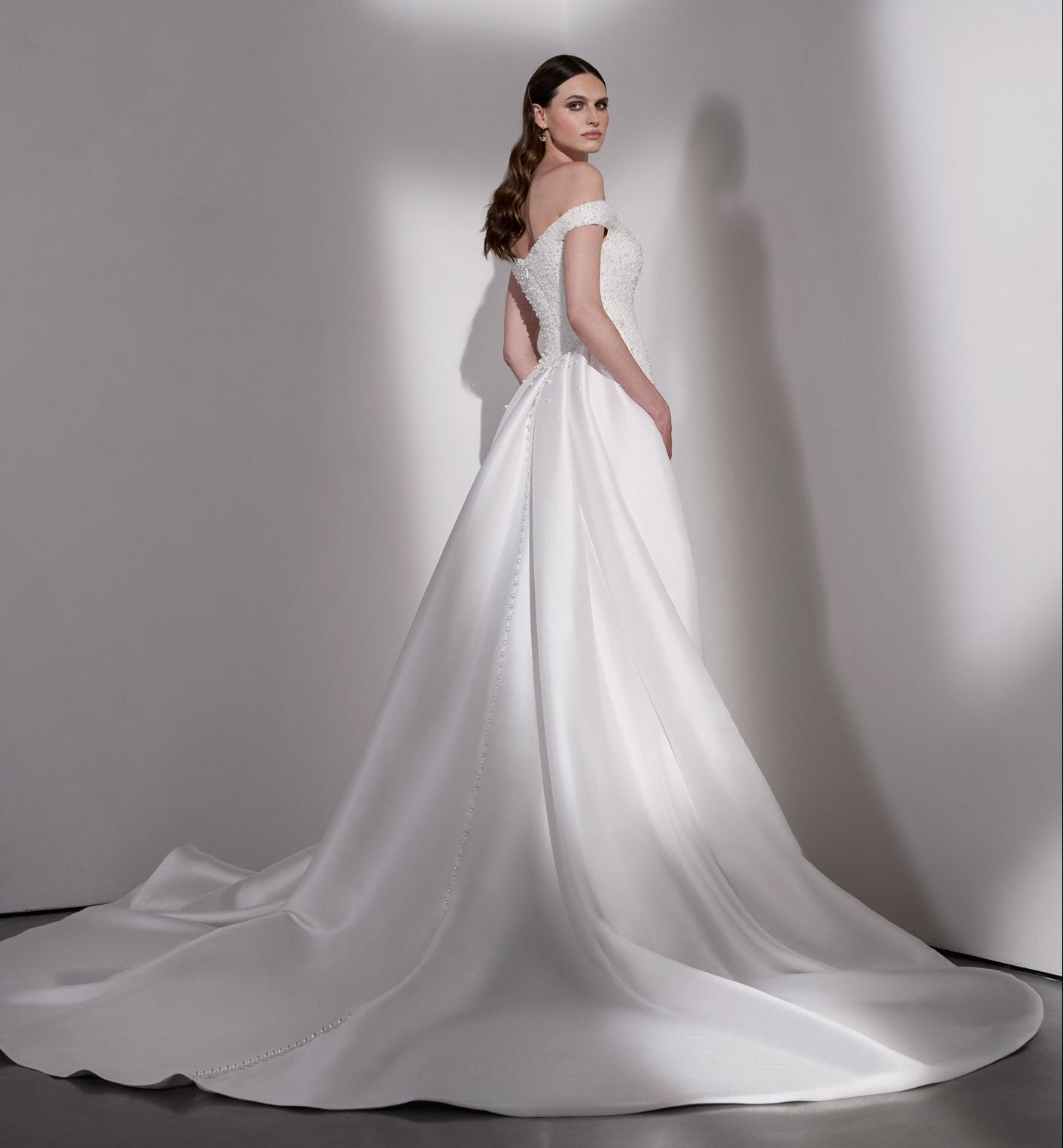 Pearl beaded sheath dress with detachable
mikado overskirt
