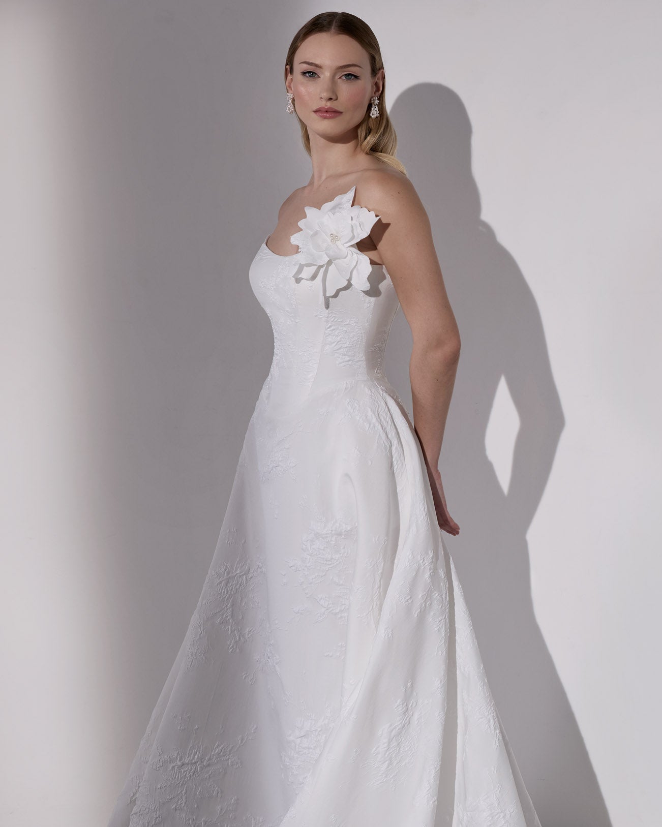 Embossed jacquard basque waist A-Line with
lace-up back and detachable flower