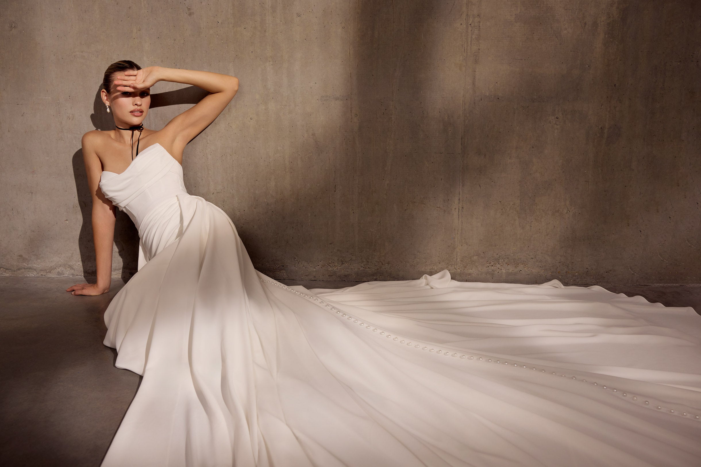 Strapless georgette draped sheath dress with
optional cathedral skirt