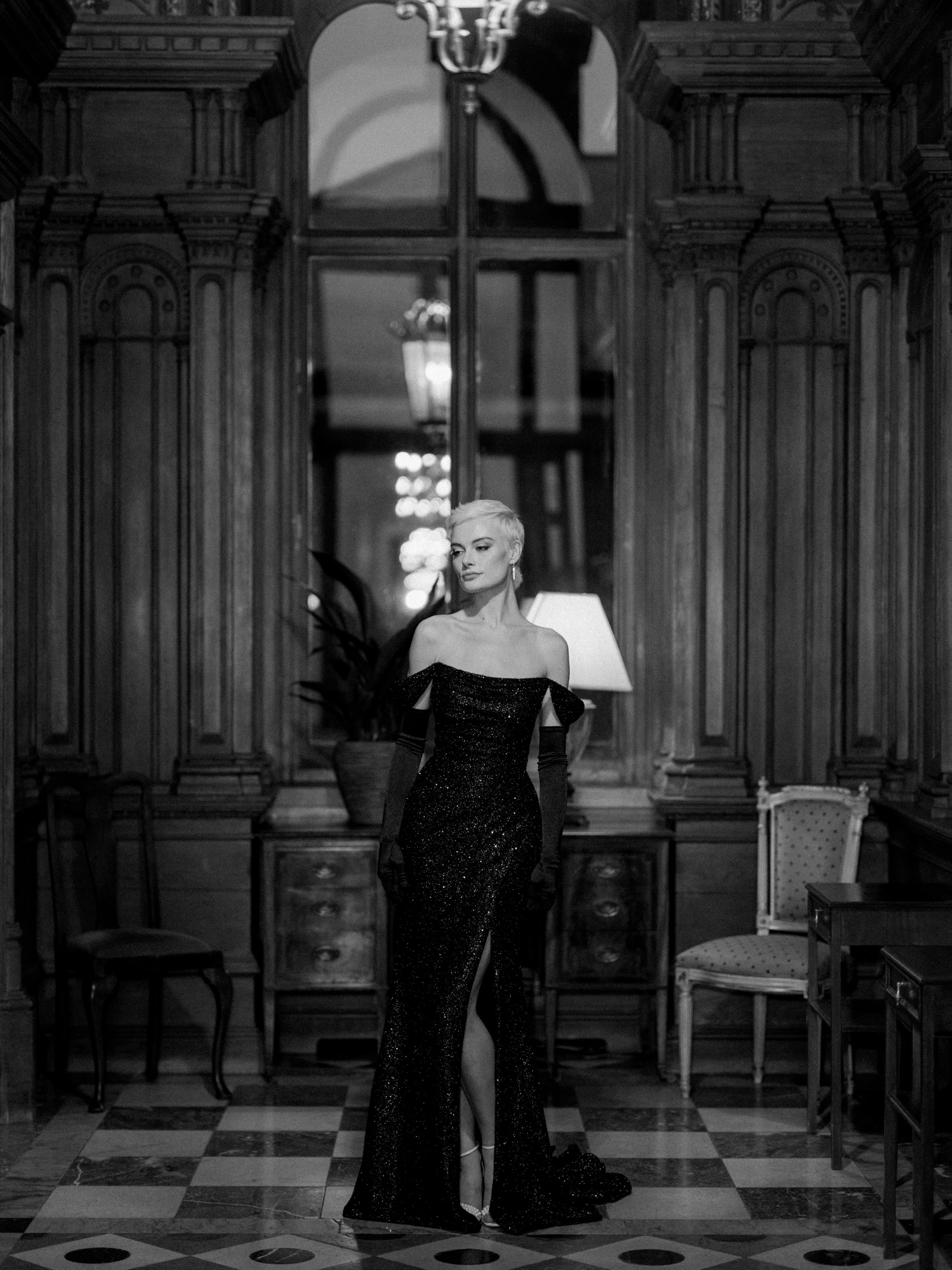 black noir stretch sparkle jersey fabric scoop neckline figure hugging dress with skirt split and detachable straps