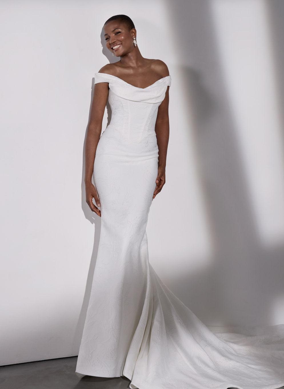 Embossed jacquard basque waist sheath
dress and detachable overskirt