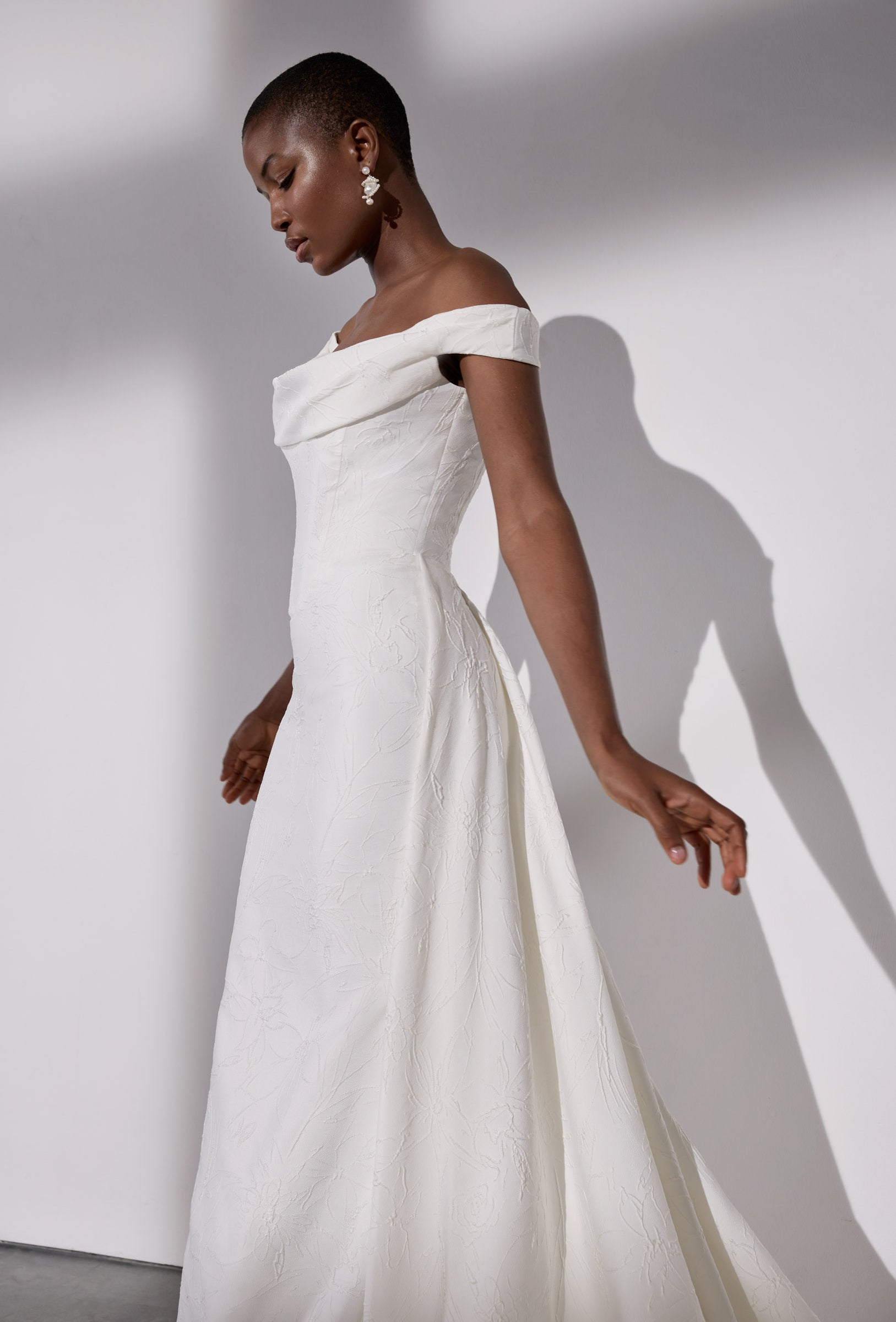 Embossed jacquard basque waist sheath
dress and detachable overskirt