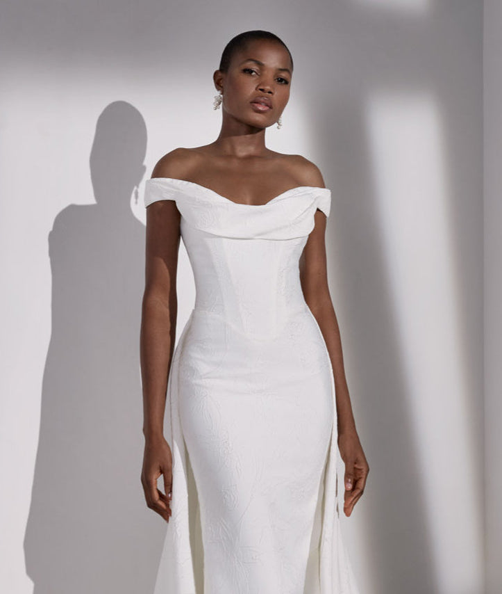 Embossed jacquard basque waist sheath
dress and detachable overskirt