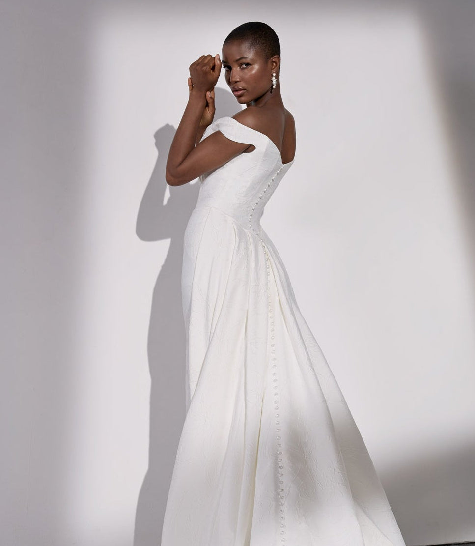 Embossed jacquard basque waist sheath
dress and detachable overskirt