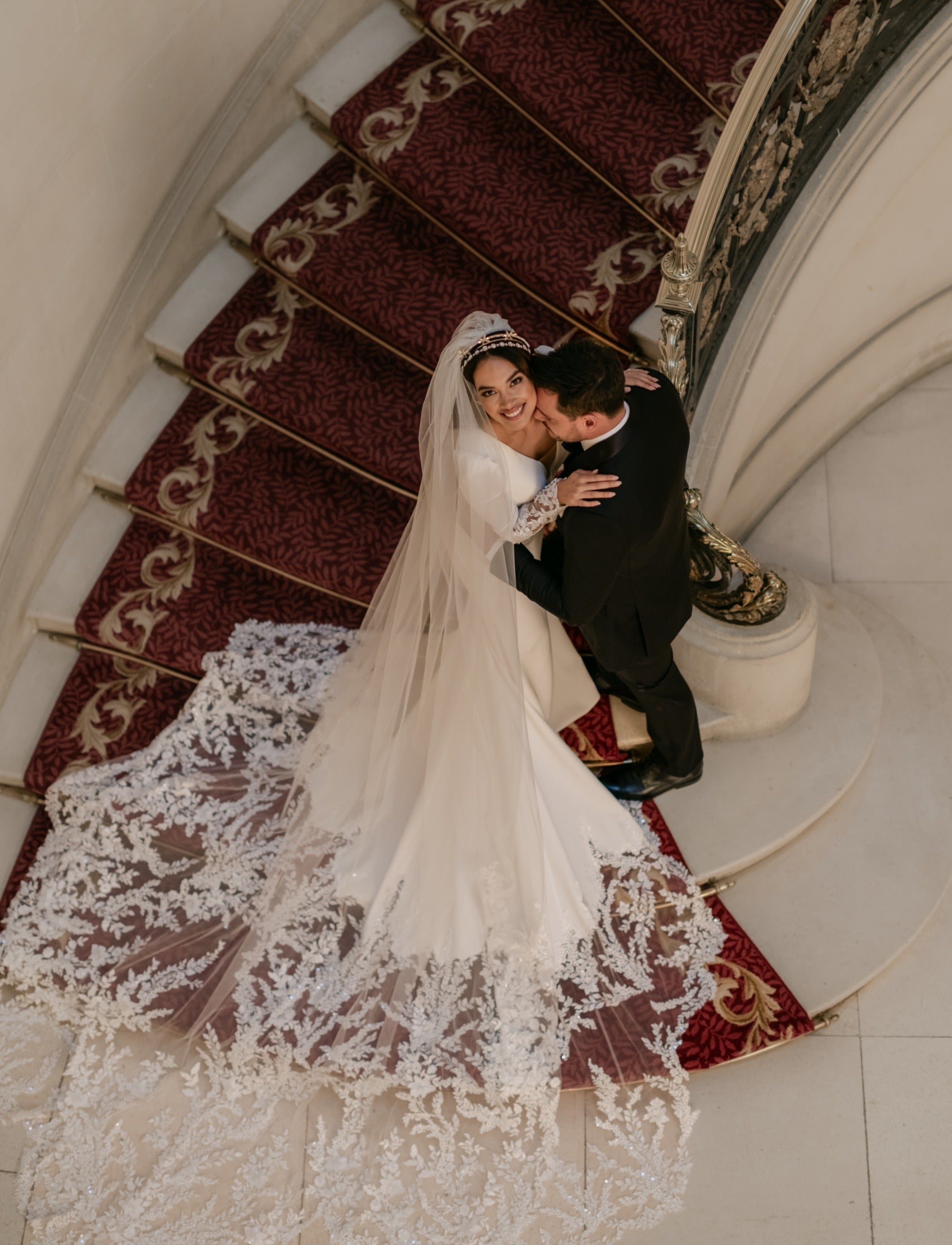 crepe plunge pleat neckline and soft fishtail silhouette with encrusted lace sleeves and train with matching single tier lace veil