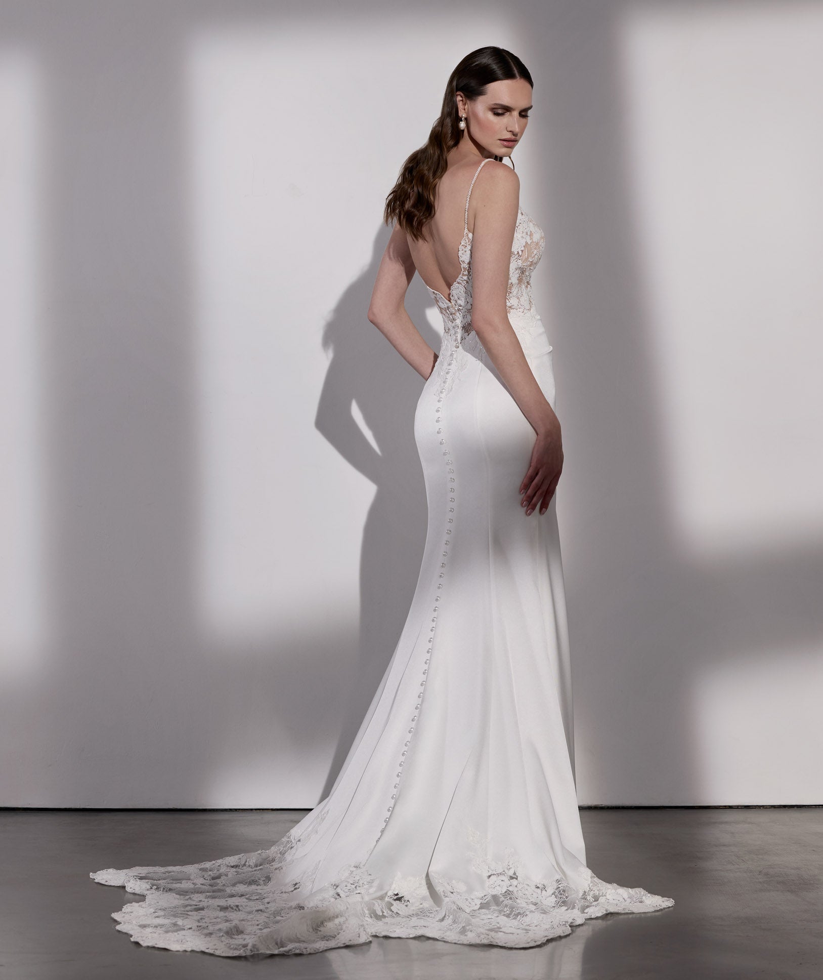 French-look embellished lace sheath dress with detachable sleeves and illusion train