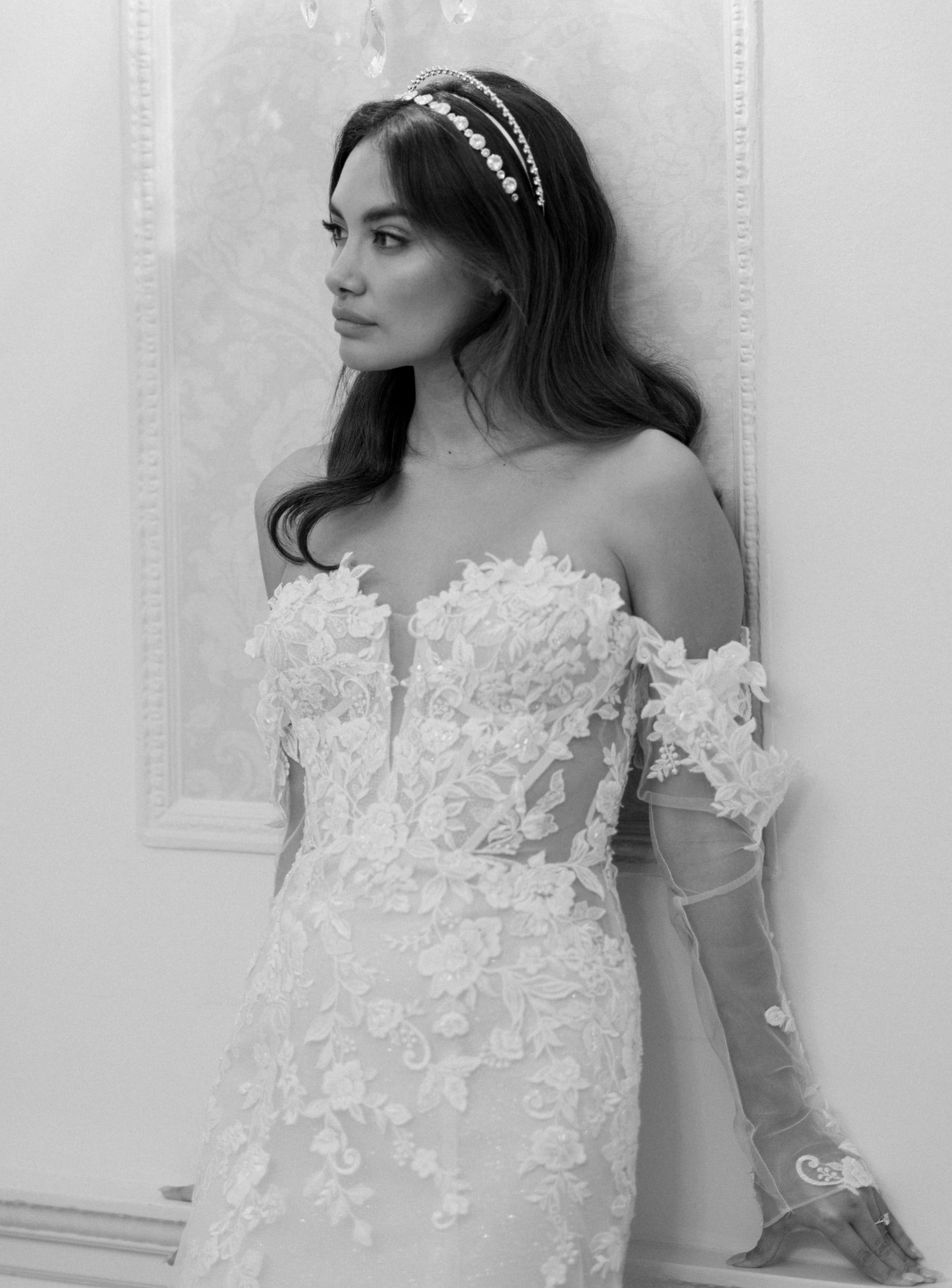 layered floral lace fishtail gown with strapless neckline and detachable sleeves