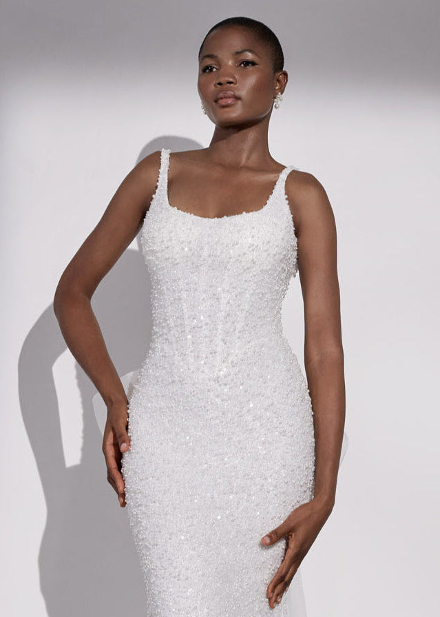 Square-neck pearl beaded sheath dress with
basque waist and corset and detachable organza bow