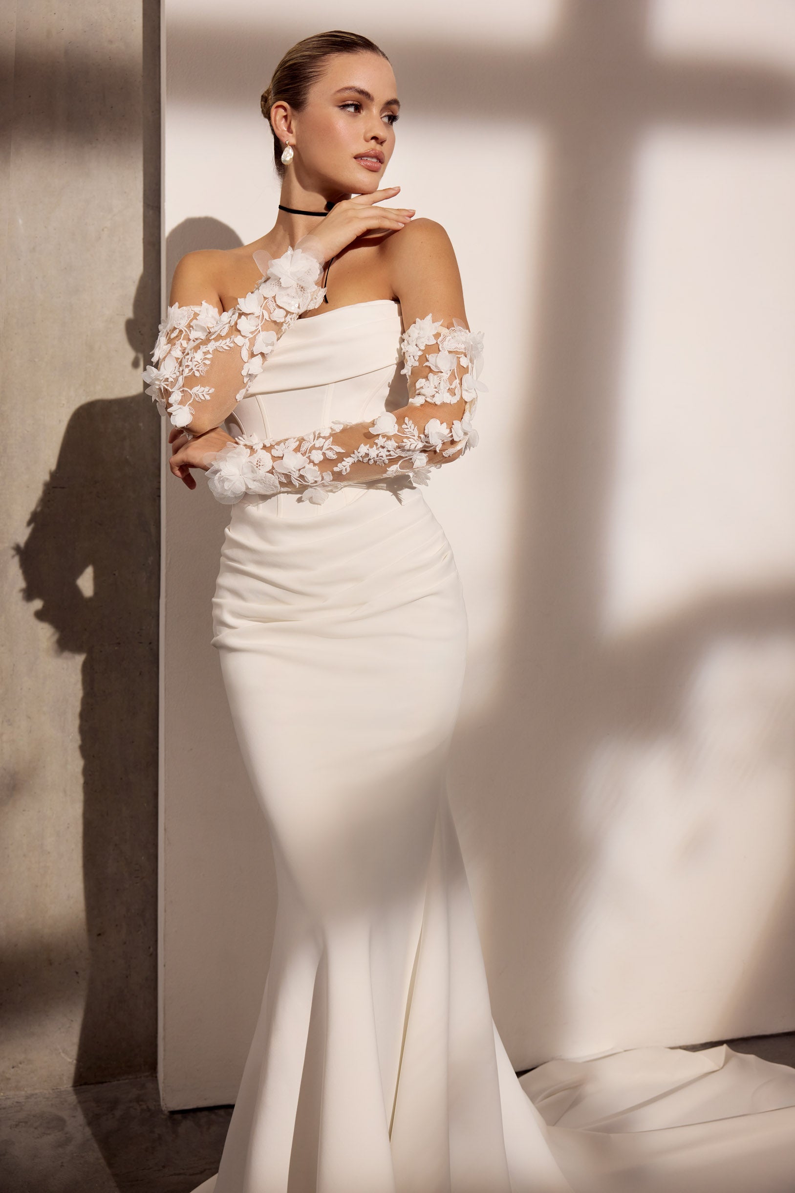 Strapless lux stretch crepe sheath dress with
flattering pleating and boned bodice with lace and 3d embroidery flowers sleeves