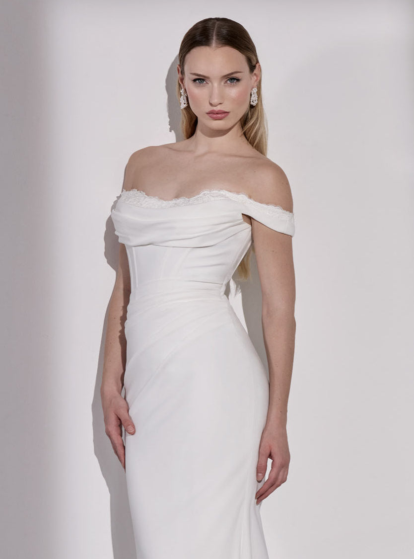 Georgette crepe and French-look lace off-
the-shoulder sheath dress with illusion train