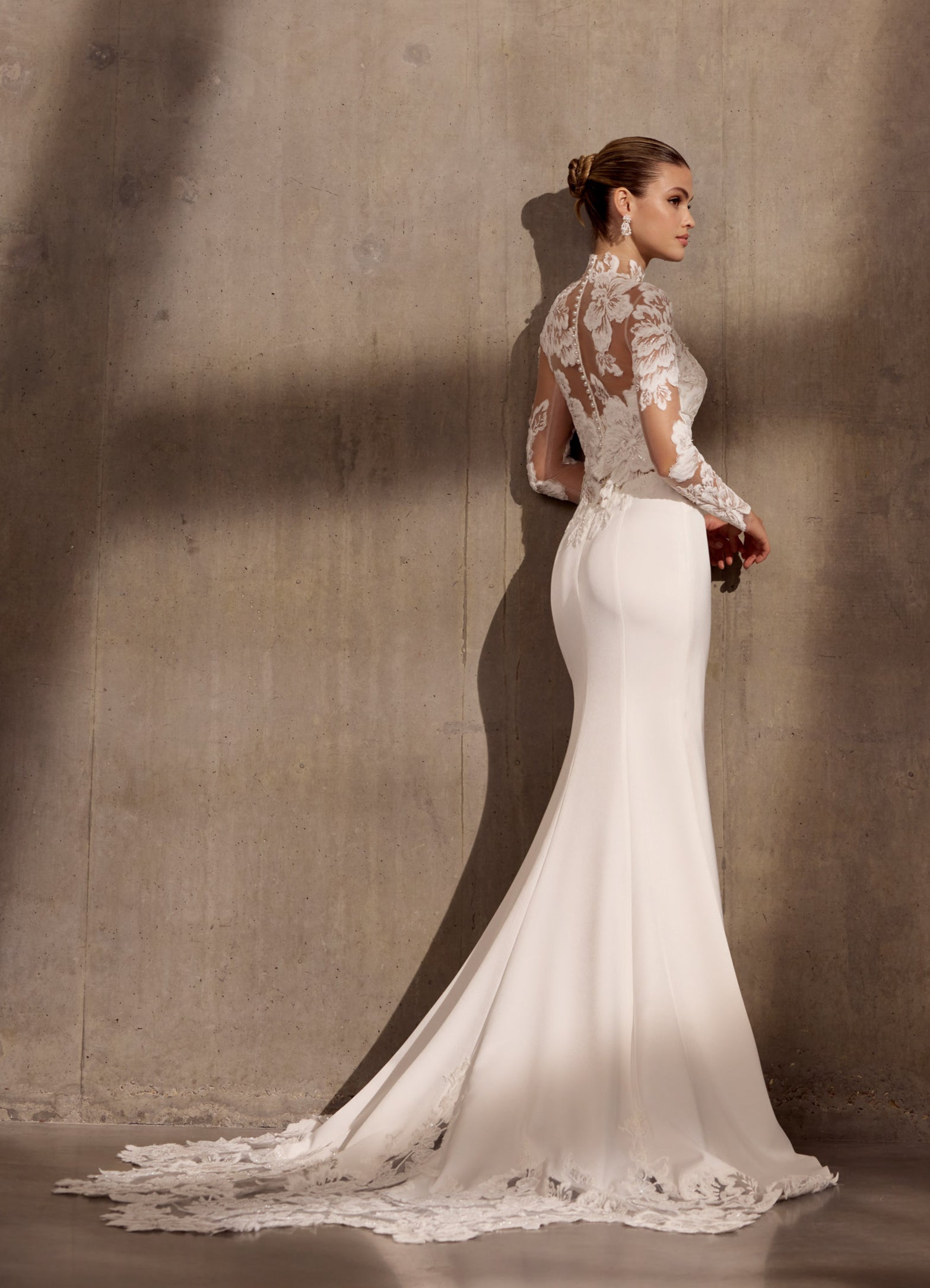 Japanese crepe sheath dress with floral
applique embellishment and illusion train.
Optional matching lace sleeve jacket with buttons