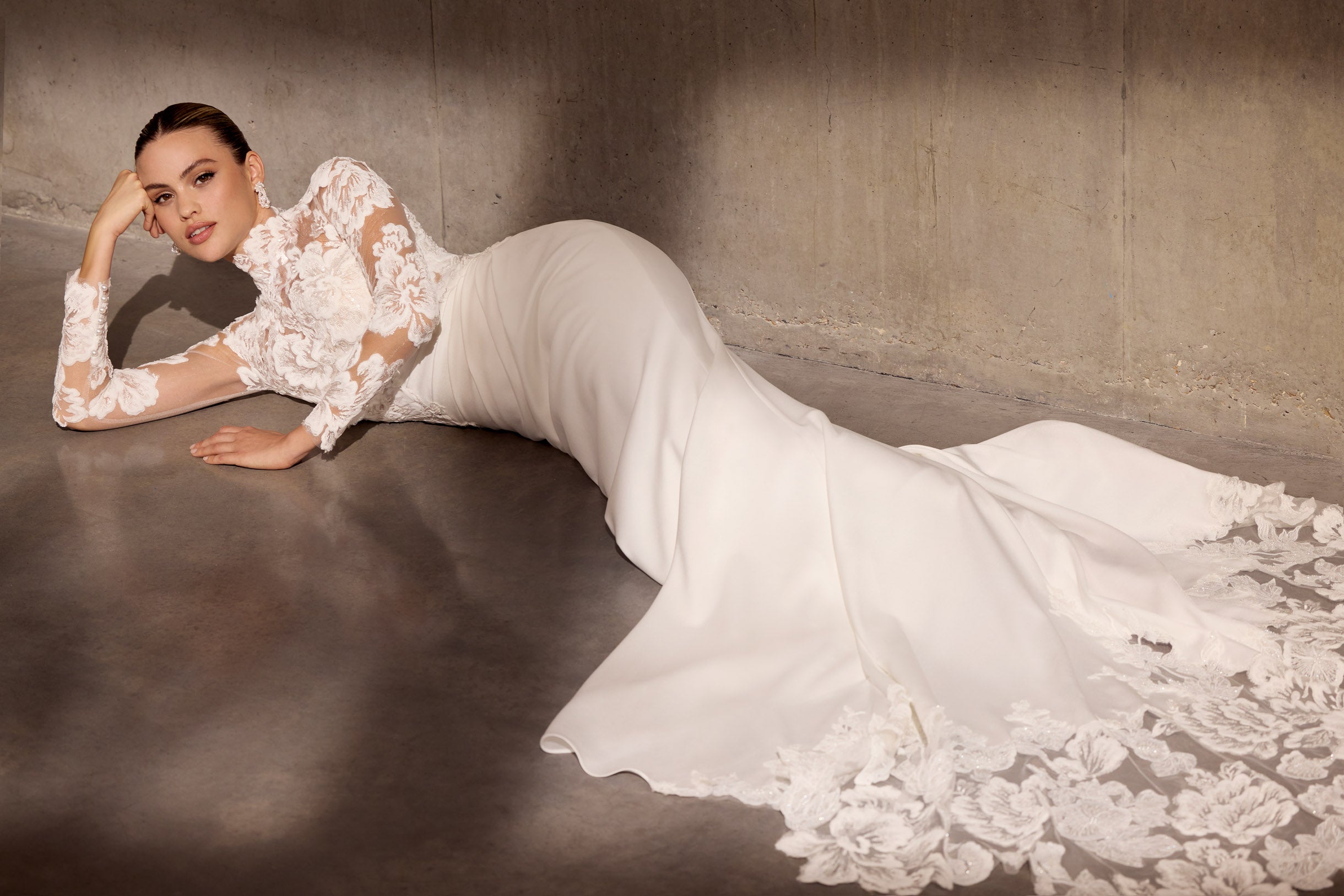 Japanese crepe sheath dress with floral
applique embellishment and illusion train.
Optional matching lace sleeve jacket