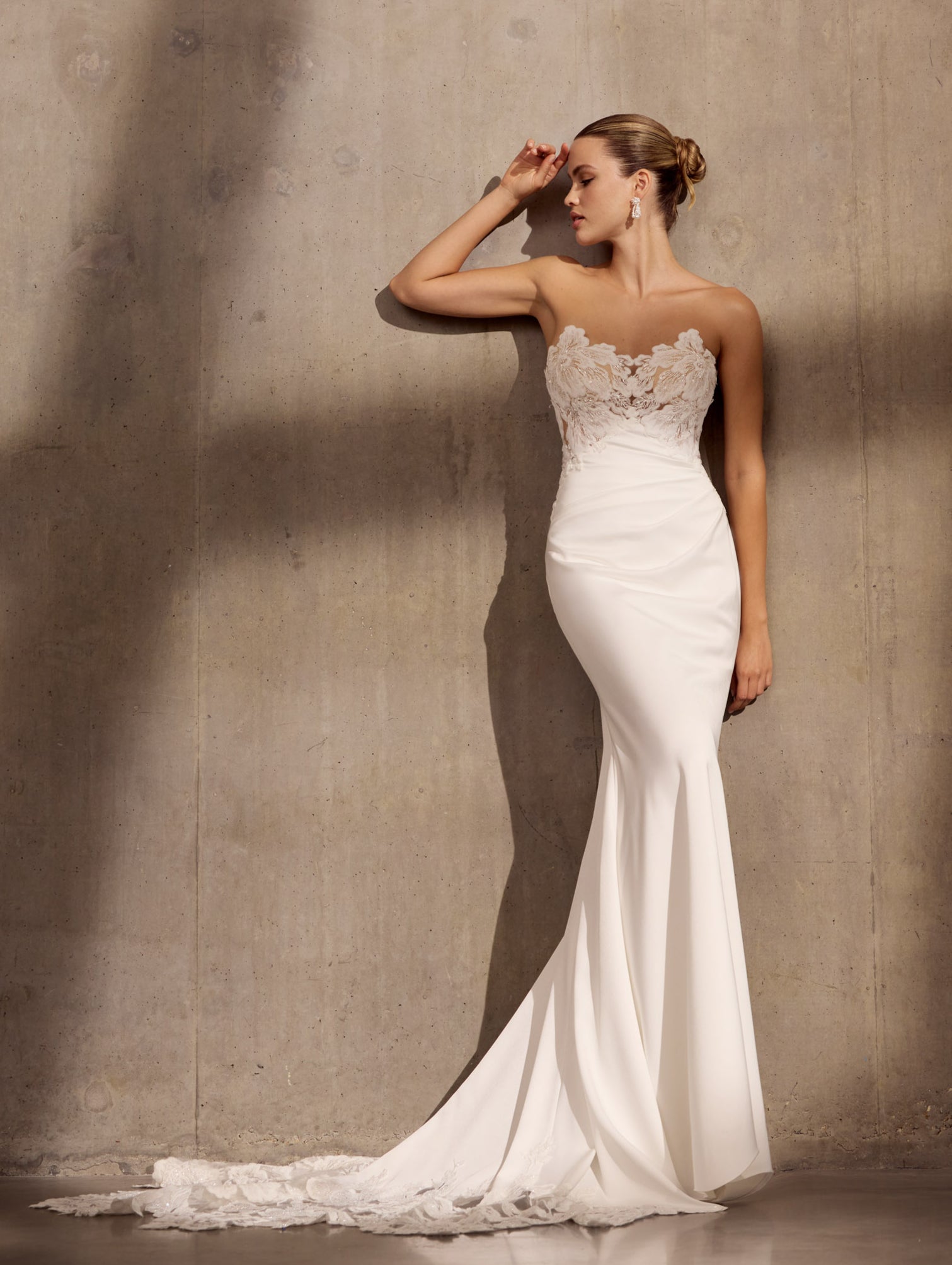 Japanese crepe sheath dress with floral
applique embellishment and illusion train.
Optional detachable applique shrug