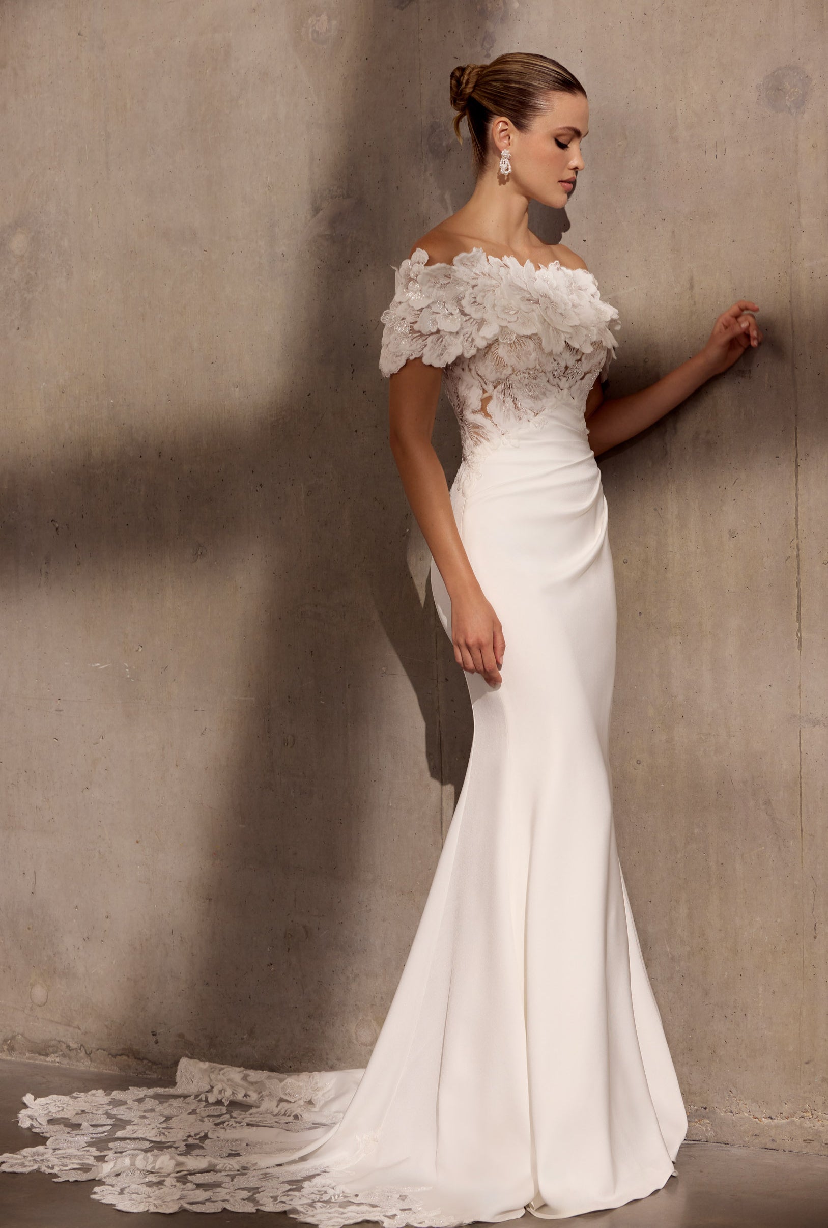 Japanese crepe sheath dress with floral
applique embellishment and illusion train.
Optional detachable applique shrug