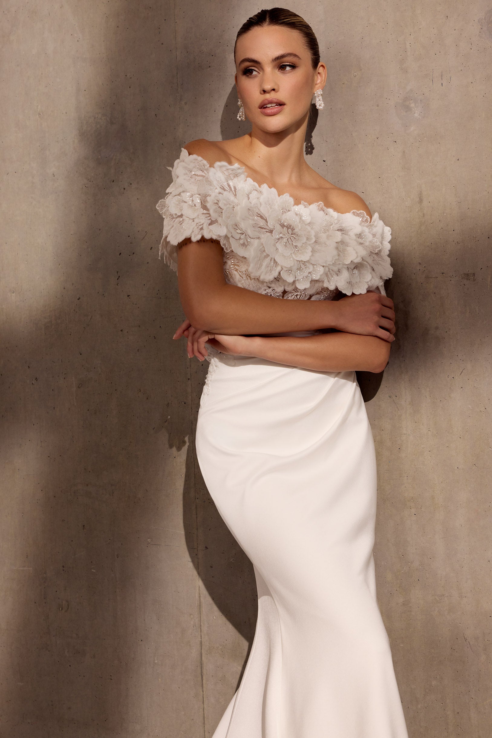 Japanese crepe sheath dress with floral
applique embellishment and illusion train.
Optional detachable applique shrug